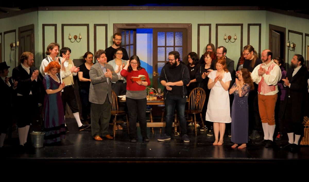 The cast and crew of Peculiar Productions' perfomance of Arcadia gather on stage to congratulate the director. Cardiff, Penarth.